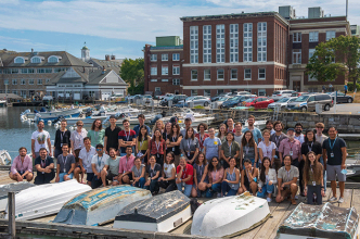 photo of BMM Summer Course class of 2022 on the dock at the Marine Biology Lab campus in Woods Hole, MA