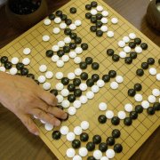Photo of two people playing Go, a game of strategy. Photograph: Cheryl Hatch/AP 